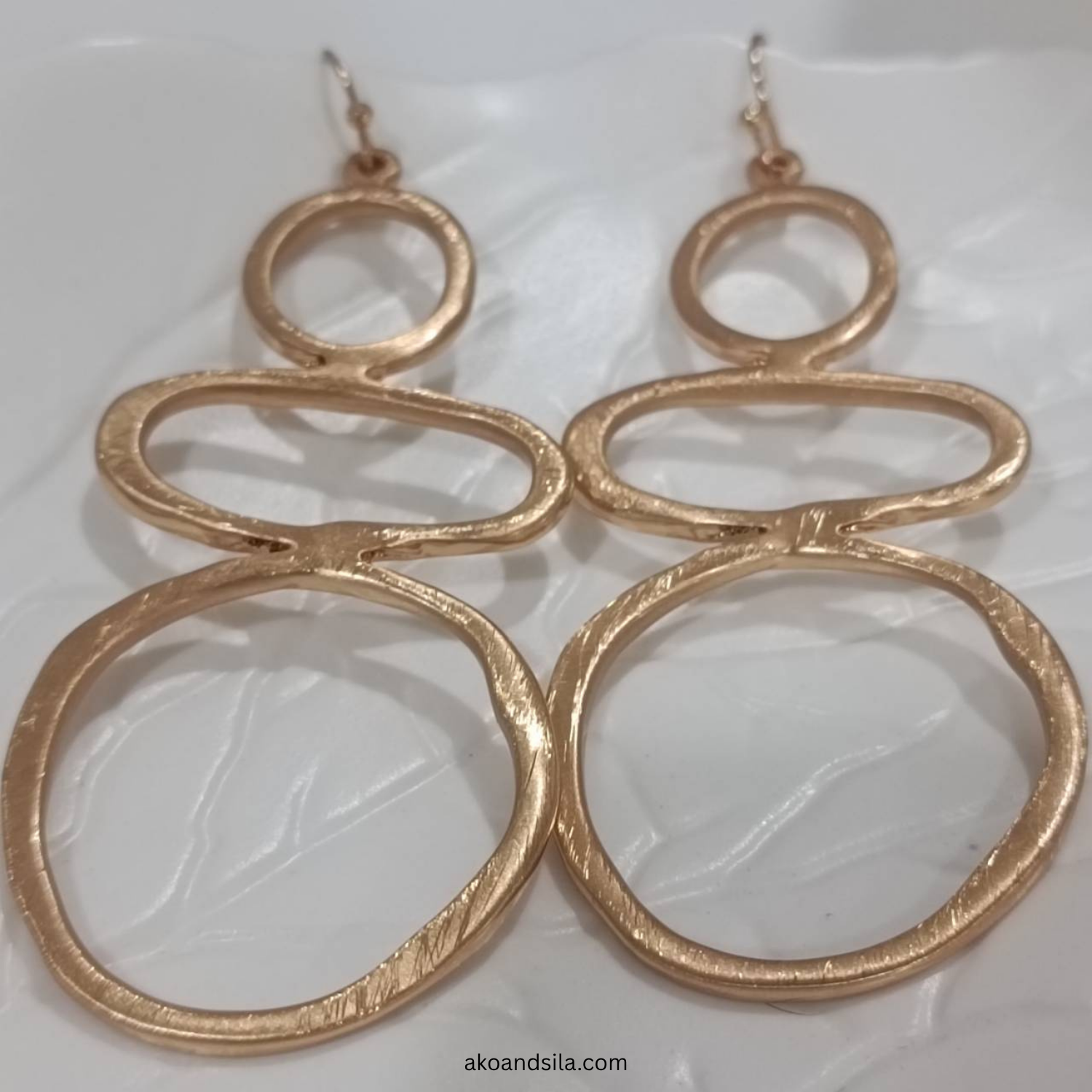 Golden Triple Circle Drop Earrings - Image 3